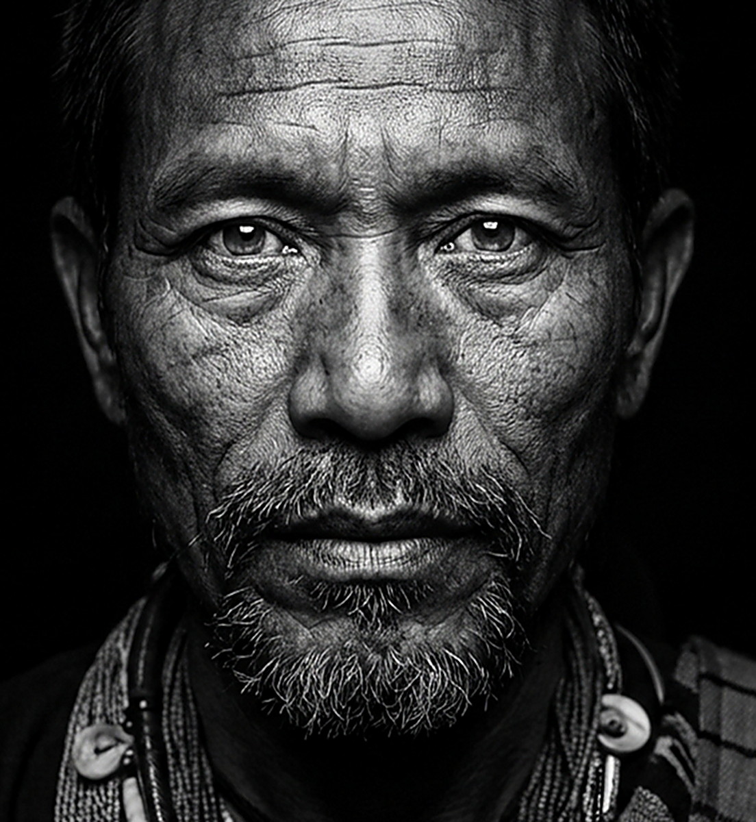 Close portrait of an elder from Northeast India in black and white