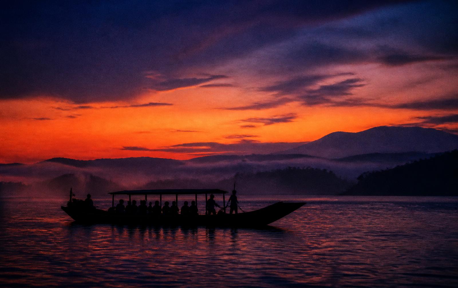 A ferry crossing the Brahmaputra at dusk